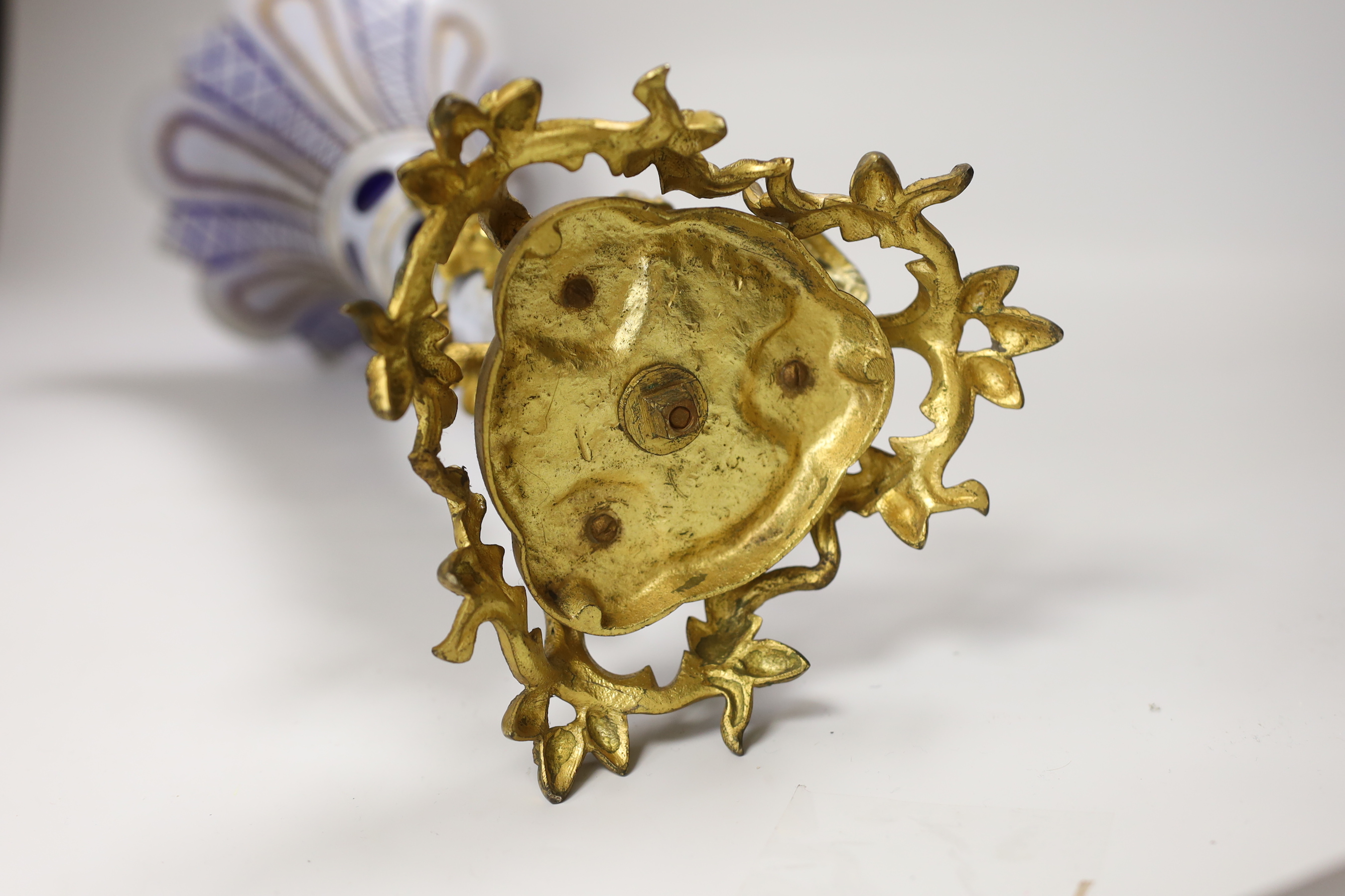 A 19th century Bohemian overlaid glass trumpet vase, on an ornate gilt metal stand, 44cm high